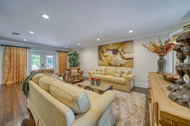 a bed room with furniture and a flat screen tv