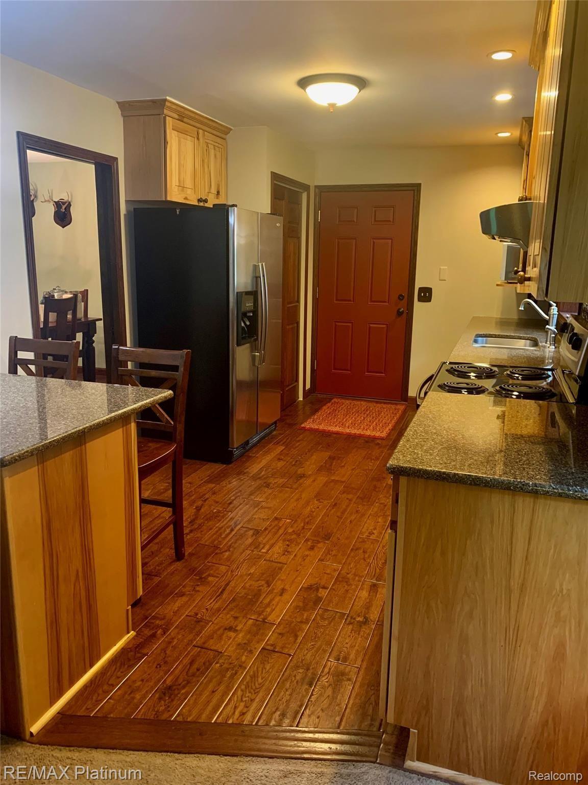 3770 Pinckney Road Howell, MI 48843 - Photo 13 of 45 Check out the Hand Scraped Wood Floor!