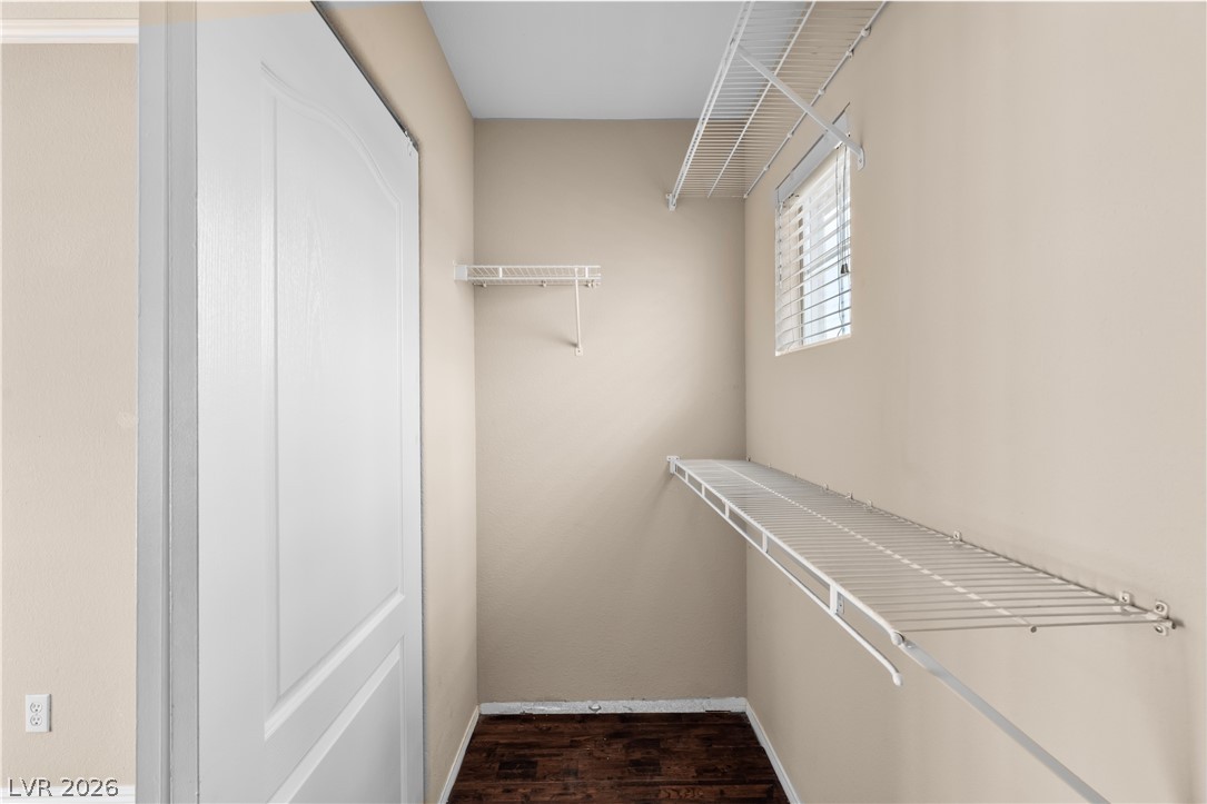 708 Vortex Avenue Henderson, NV 89002 - Photo 30 of 71 Ample shelving maximizes storage potential in this well-lit walk-in closet.