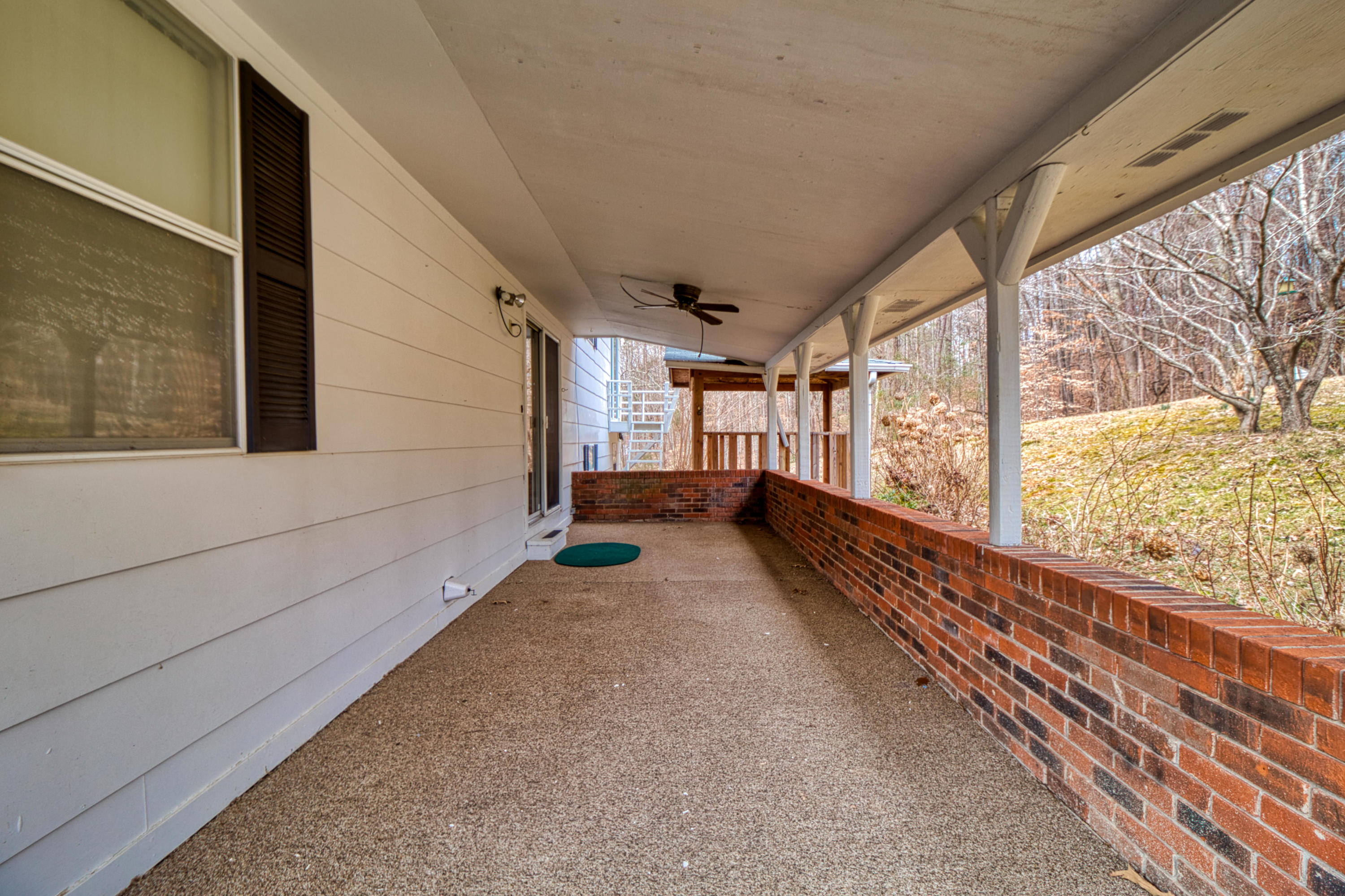 199 Davidson Hollow Road Heiskell, TN 37754 - Photo 26 of 30 Spacious back porch with ceiling fan