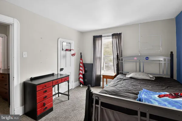 a bed room with a bed and a window
