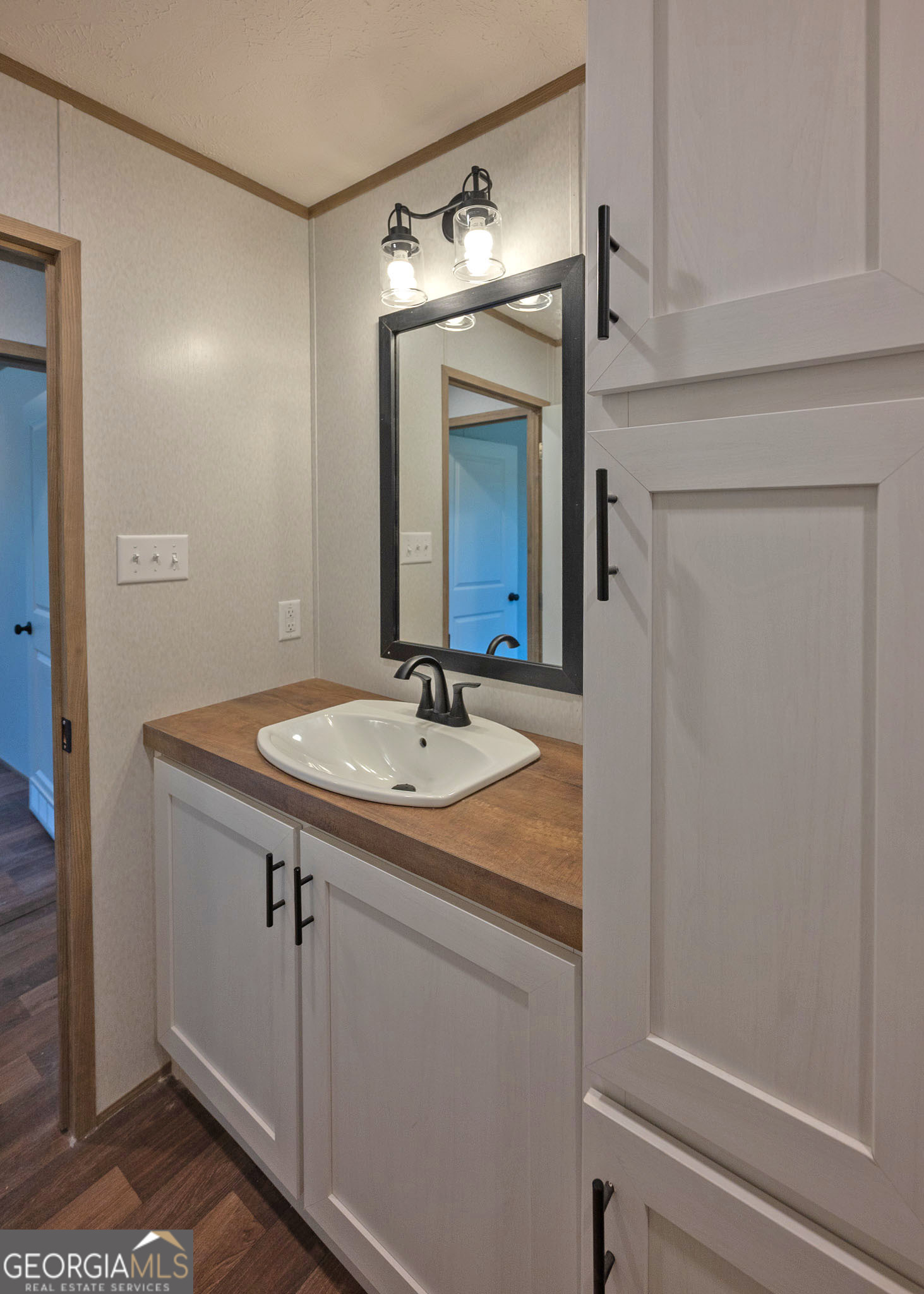 413 Griffin Road Martin, GA 30557 - Photo 27 of 31 a bathroom with a sink and a mirror