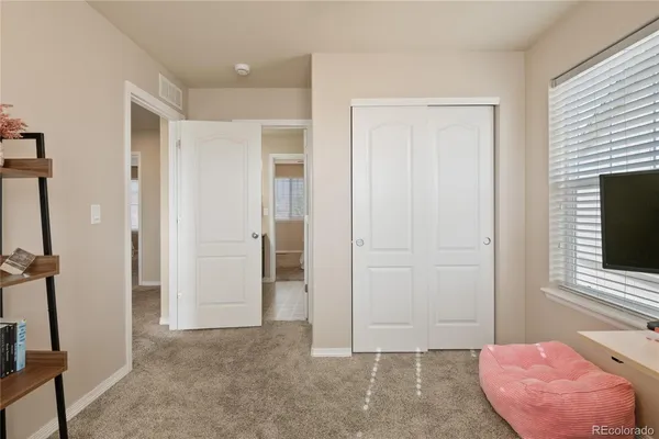 a view of room with furniture and a fireplace