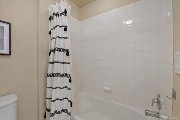 a bathroom with a bathtub and shower