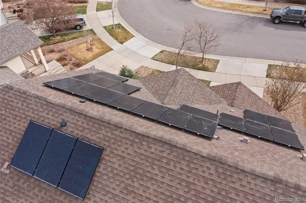 an aerial view of a house with a lake view