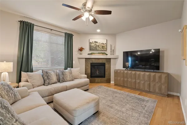 a living room with furniture and a fireplace