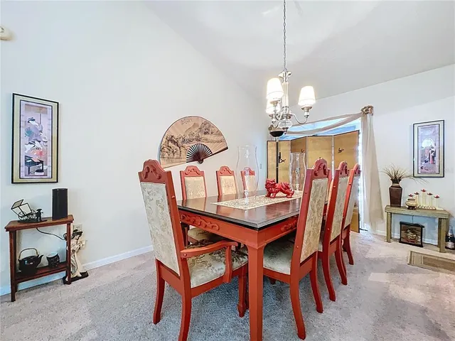 a dining room with furniture and window