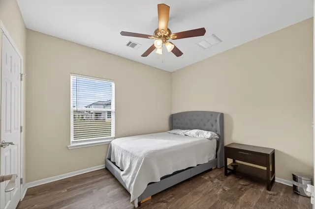 a bedroom with a bed and window