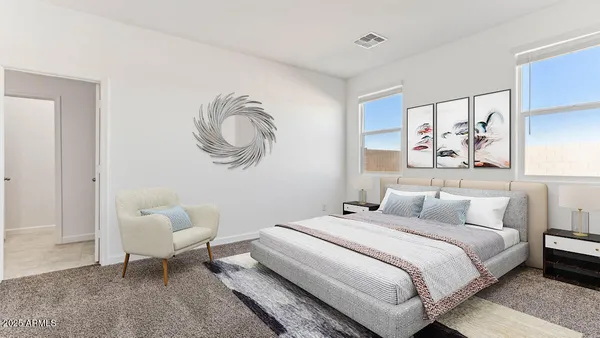 a bedroom with a bed and couch