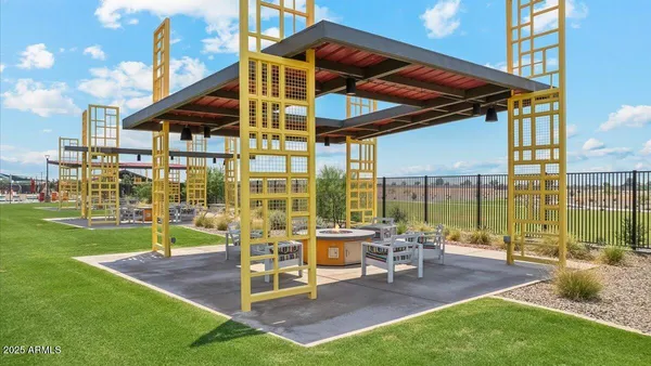 a view of a chairs and table in patio