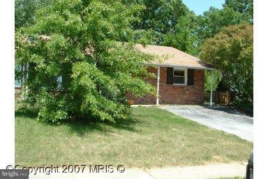 1319 Greyswood Road Odenton, MD 21113 - Photo 1 of 1 a backyard of a house with plants and tree
