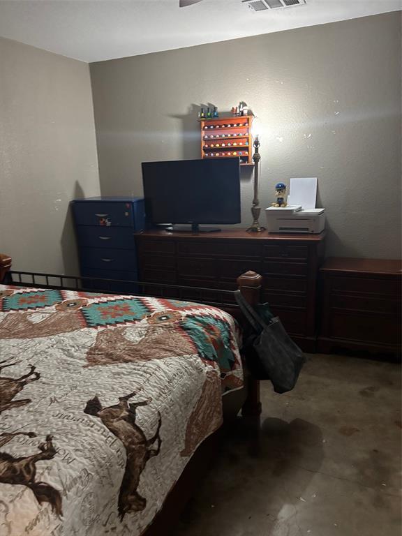 1528-1532 McFerrin Avenue Waco, TX 76708 - Photo 18 of 21 a bedroom with a bed and dresser