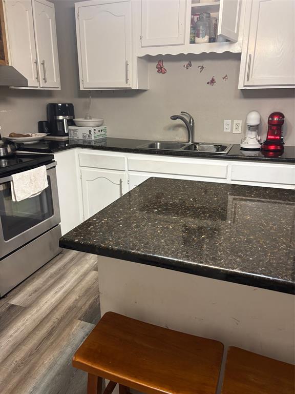 1528-1532 McFerrin Avenue Waco, TX 76708 - Photo 21 of 21 a kitchen with granite countertop a sink a stove and cabinets