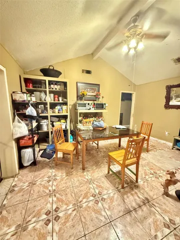 a kitchen with a sink and a refrigerator