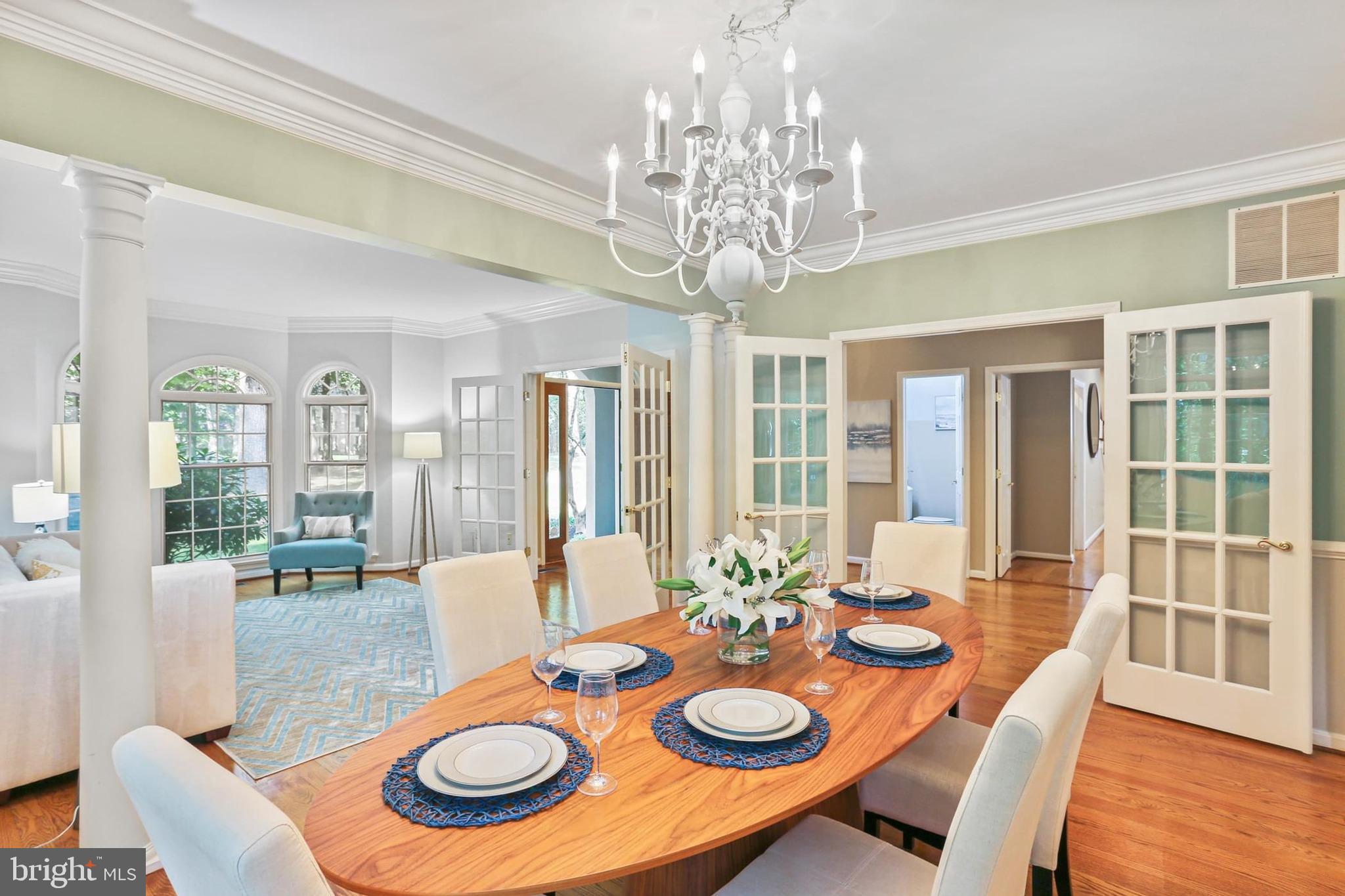 11843 Linden Chapel Road Clarksville, MD 21029 - Photo 18 of 128 a view of a dining room with furniture wooden floor and chandelier