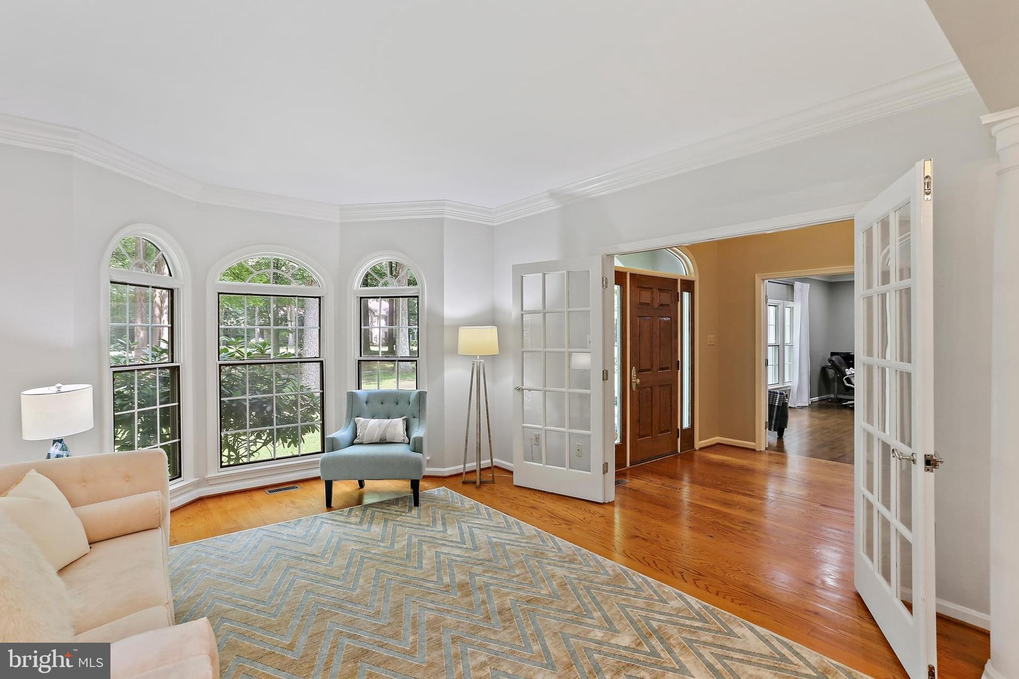11843 Linden Chapel Road Clarksville, MD 21029 - Photo 20 of 128 a large living room with furniture and floor to ceiling windows