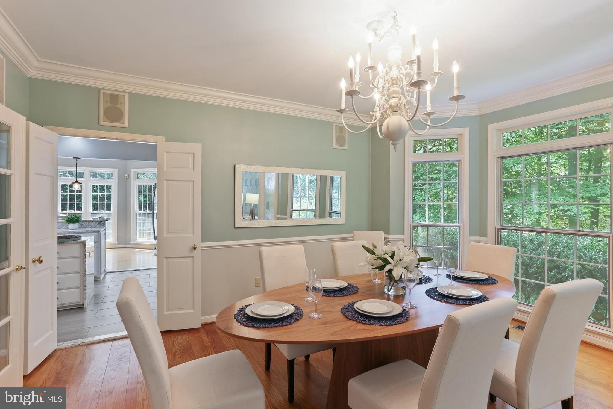 11843 Linden Chapel Road Clarksville, MD 21029 - Photo 22 of 128 a view of a dining room with furniture wooden floor and chandelier