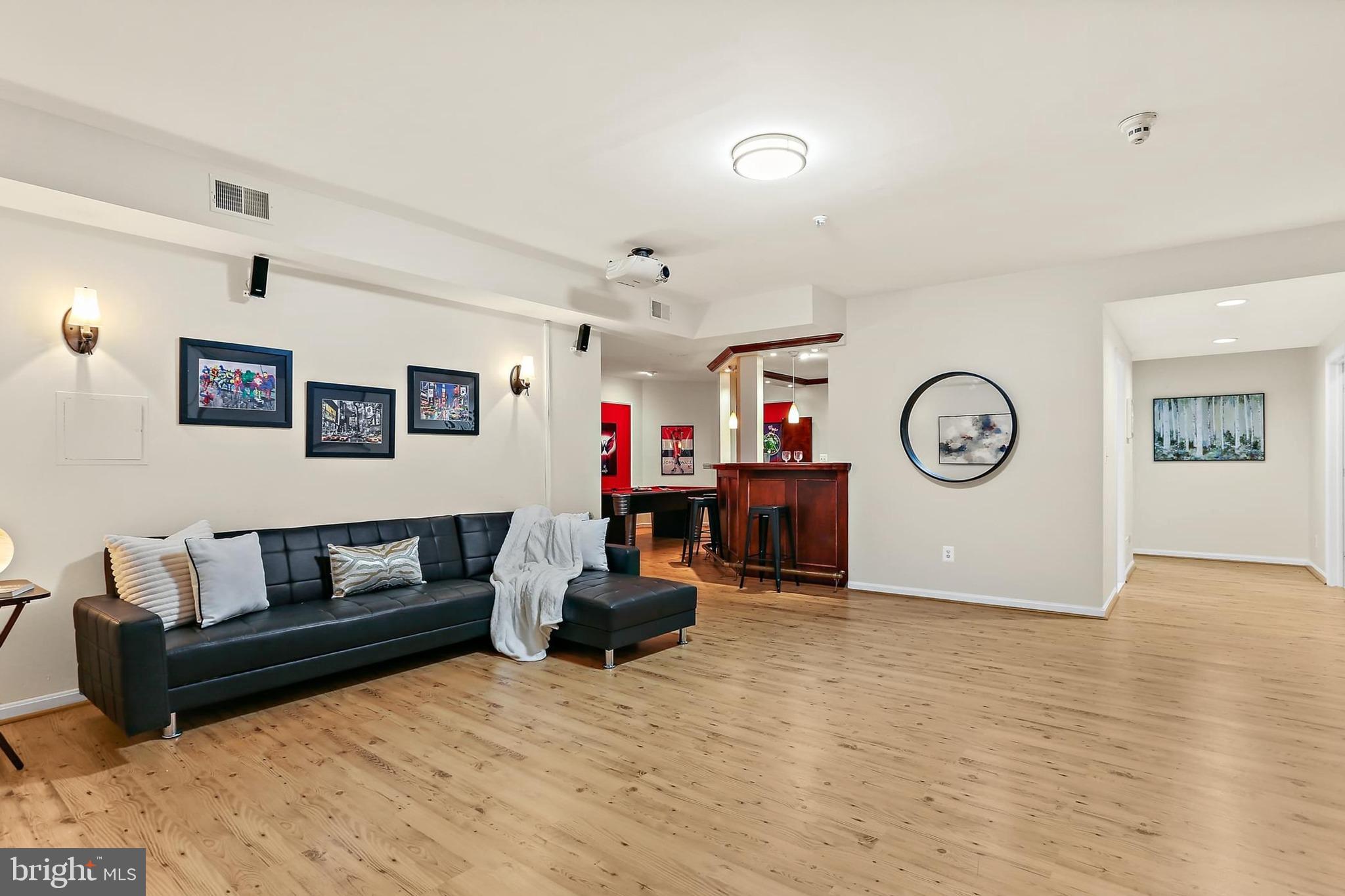 11843 Linden Chapel Road Clarksville, MD 21029 - Photo 72 of 128 a living room with furniture and a wooden floor