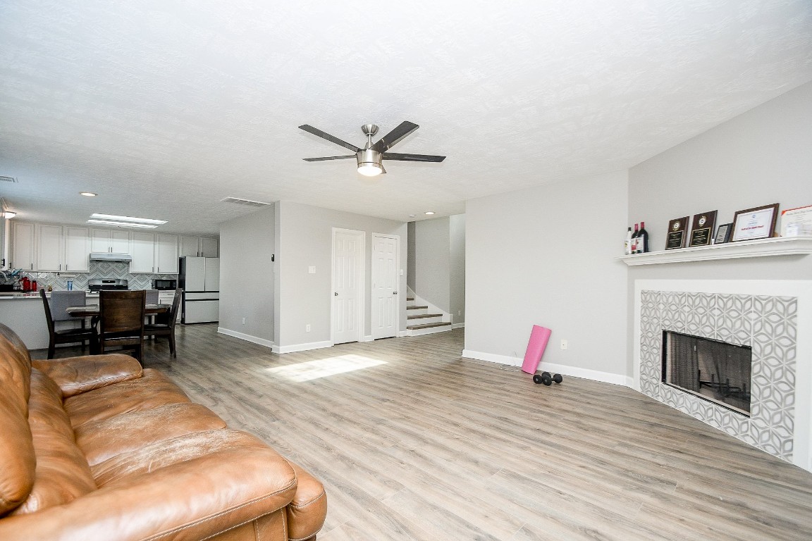 16402 Great Ridge Court Houston, TX 77083 - Photo 11 of 20 a living room with furniture and a fireplace
