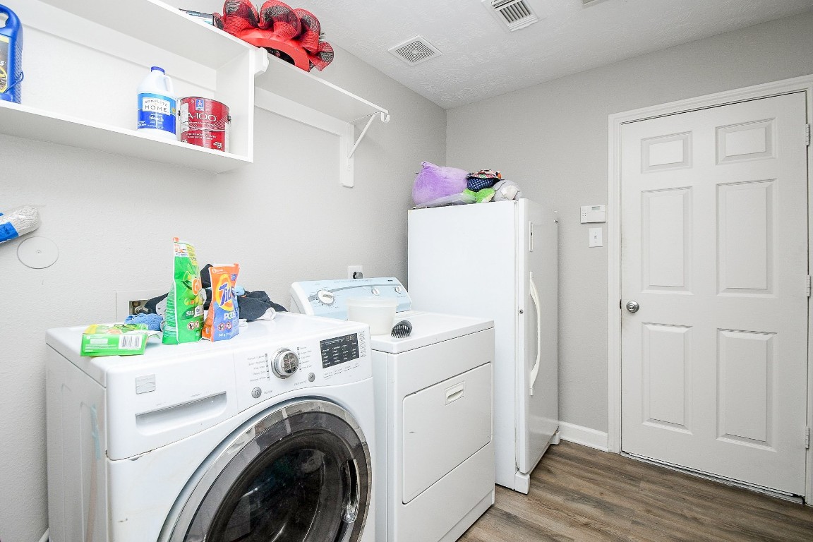 16402 Great Ridge Court Houston, TX 77083 - Photo 18 of 20 a utility room with dryer and washer