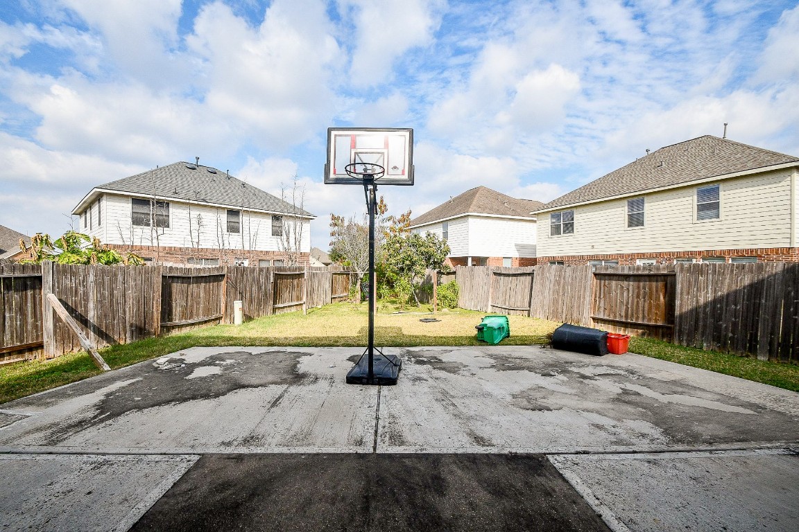 16402 Great Ridge Court Houston, TX 77083 - Photo 19 of 20 a view of front of a house with a yard