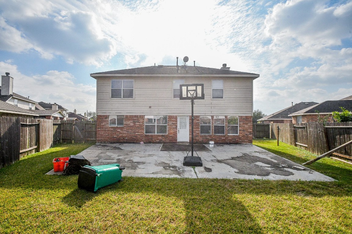 16402 Great Ridge Court Houston, TX 77083 - Photo 20 of 20 a view of a house with pool and chairs