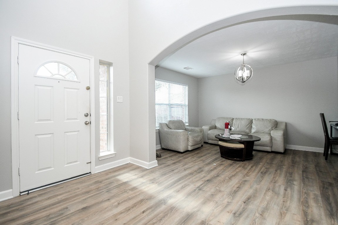16402 Great Ridge Court Houston, TX 77083 - Photo 5 of 20 a living room with furniture and a wooden floor