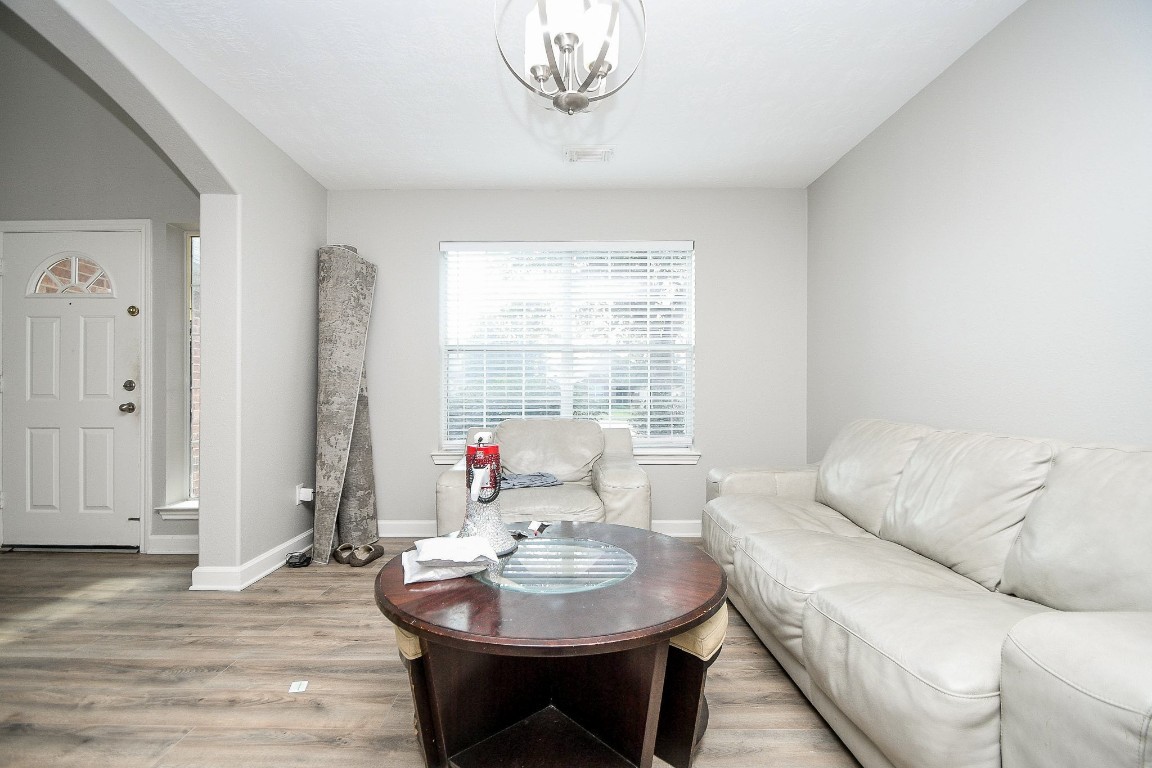 16402 Great Ridge Court Houston, TX 77083 - Photo 6 of 20 a living room with furniture and a wooden floor