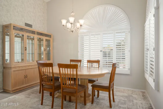 a view of a dining room with furniture window and outside view