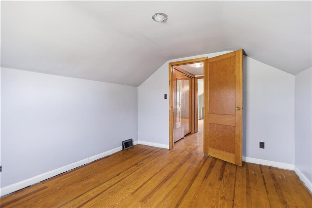64 Harmon Creek Road Burgettstown, PA 15021 - Photo 19 of 29 a view of a room with wooden floor and a ceiling fan