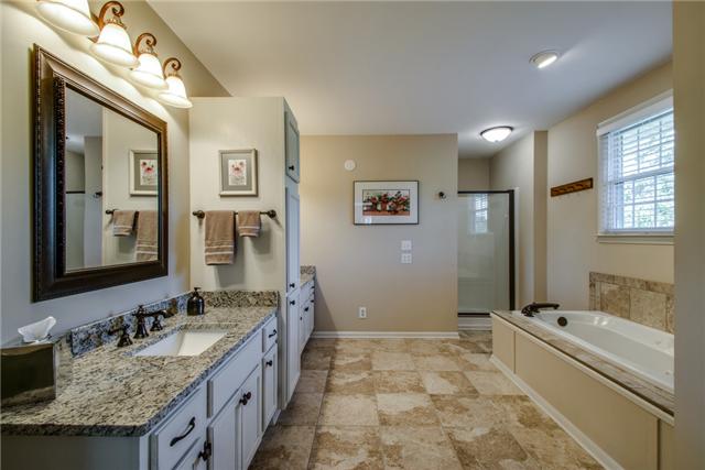 1979 Baker Road Goodlettsville, TN 37072 - Photo 14 of 20 Gorgeous Master bath with jacuzzi tub, double vanities, separate shower, granite and travertine floors.