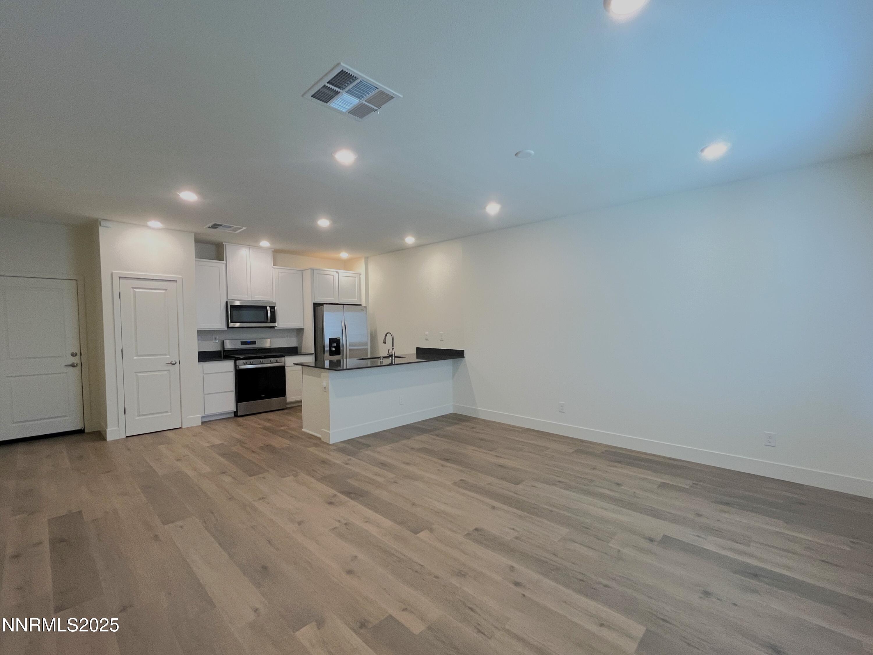 1612 Prancer Street, Unit 39 Reno, NV 89523 - Photo 2 of 10 a view of kitchen with kitchen island sink and center island
