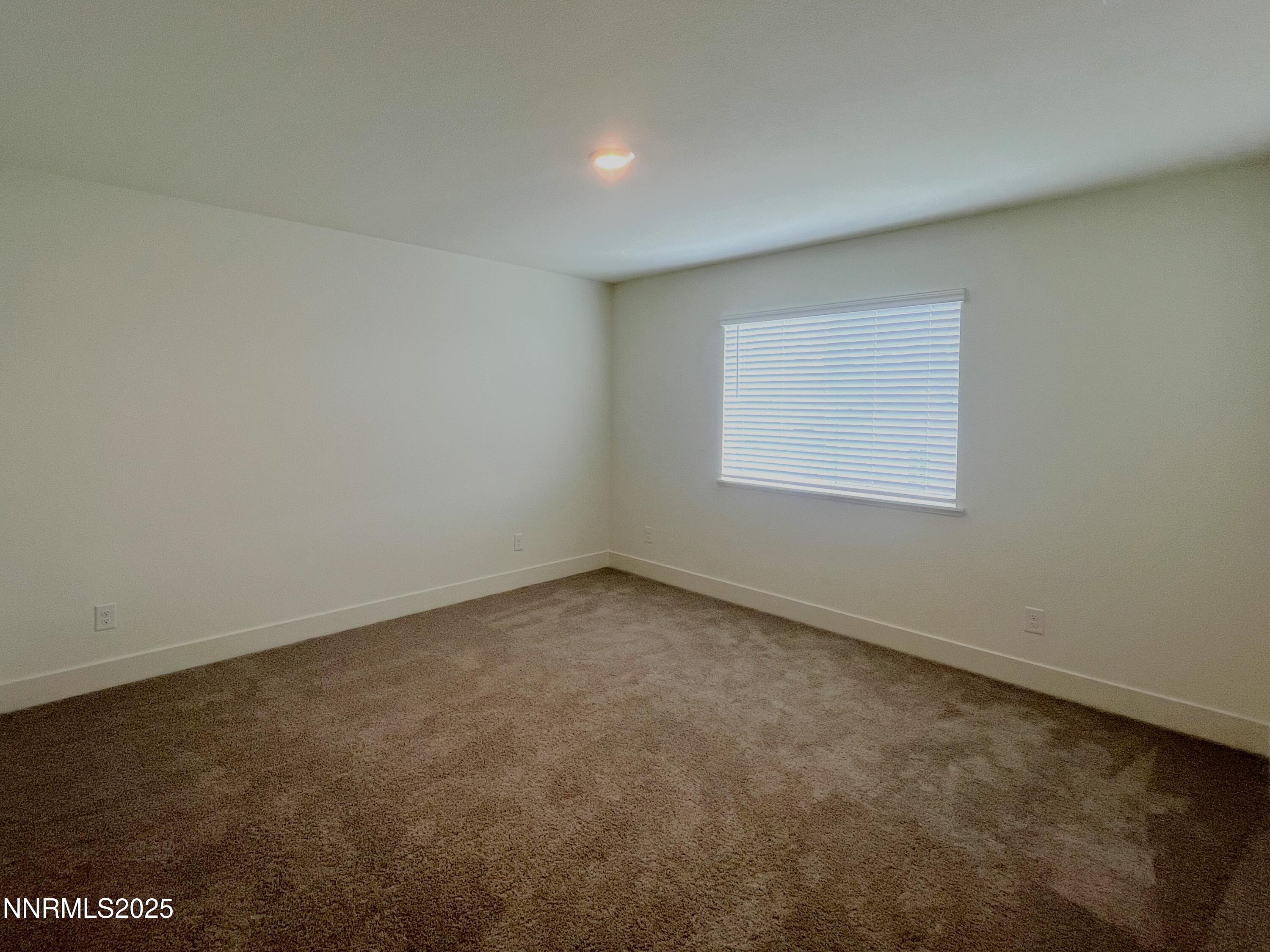 1612 Prancer Street, Unit 39 Reno, NV 89523 - Photo 4 of 10 an empty room with a window
