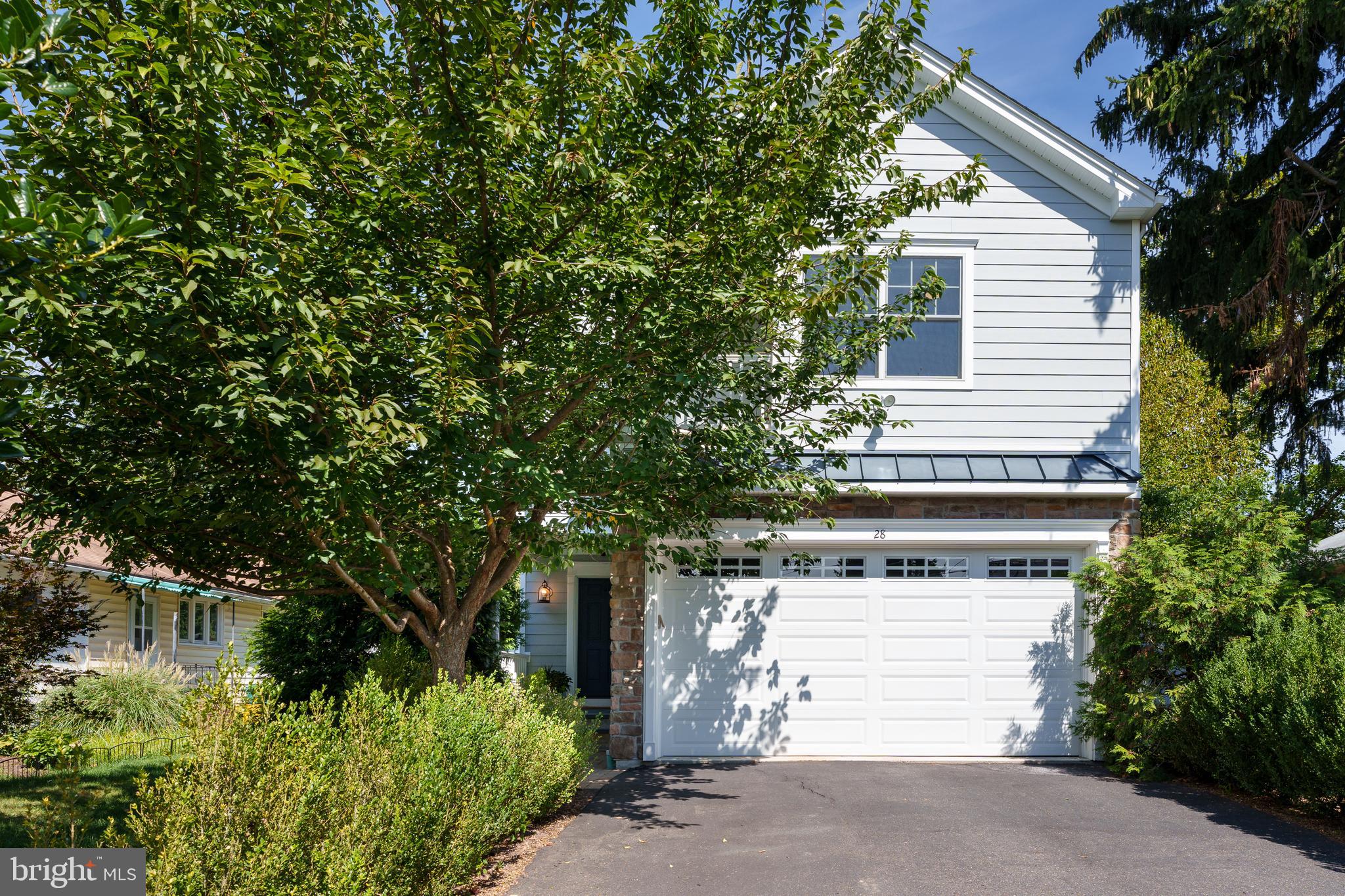 a view of a house with a tree