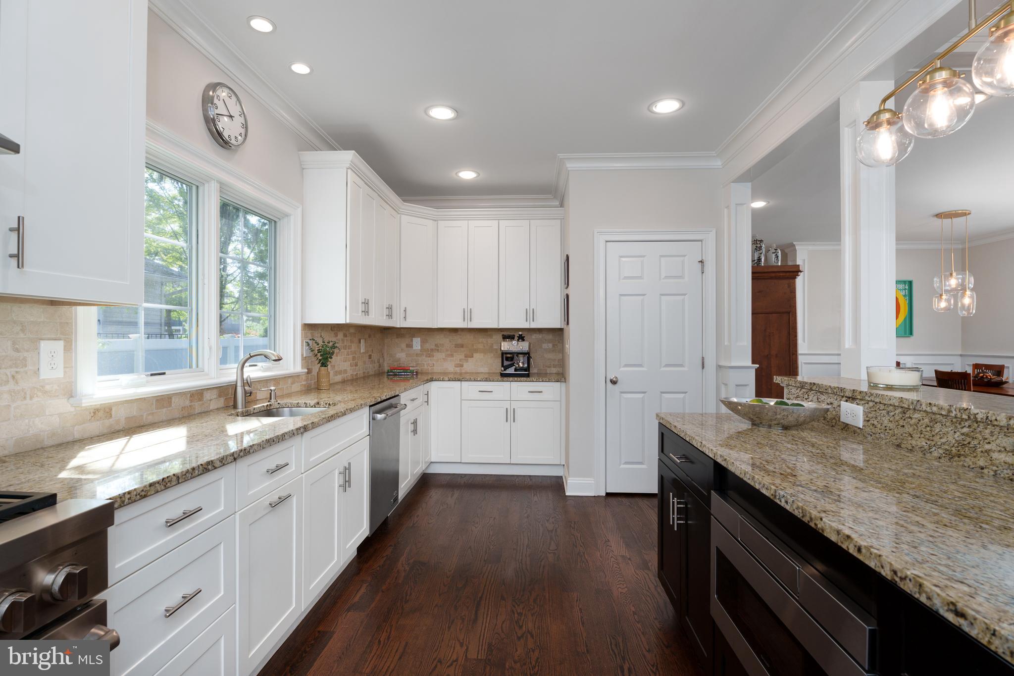 28 Hillside Road Princeton, NJ 08540 - Photo 13 of 31 a large kitchen with granite countertop a large counter top sink and stainless steel appliances