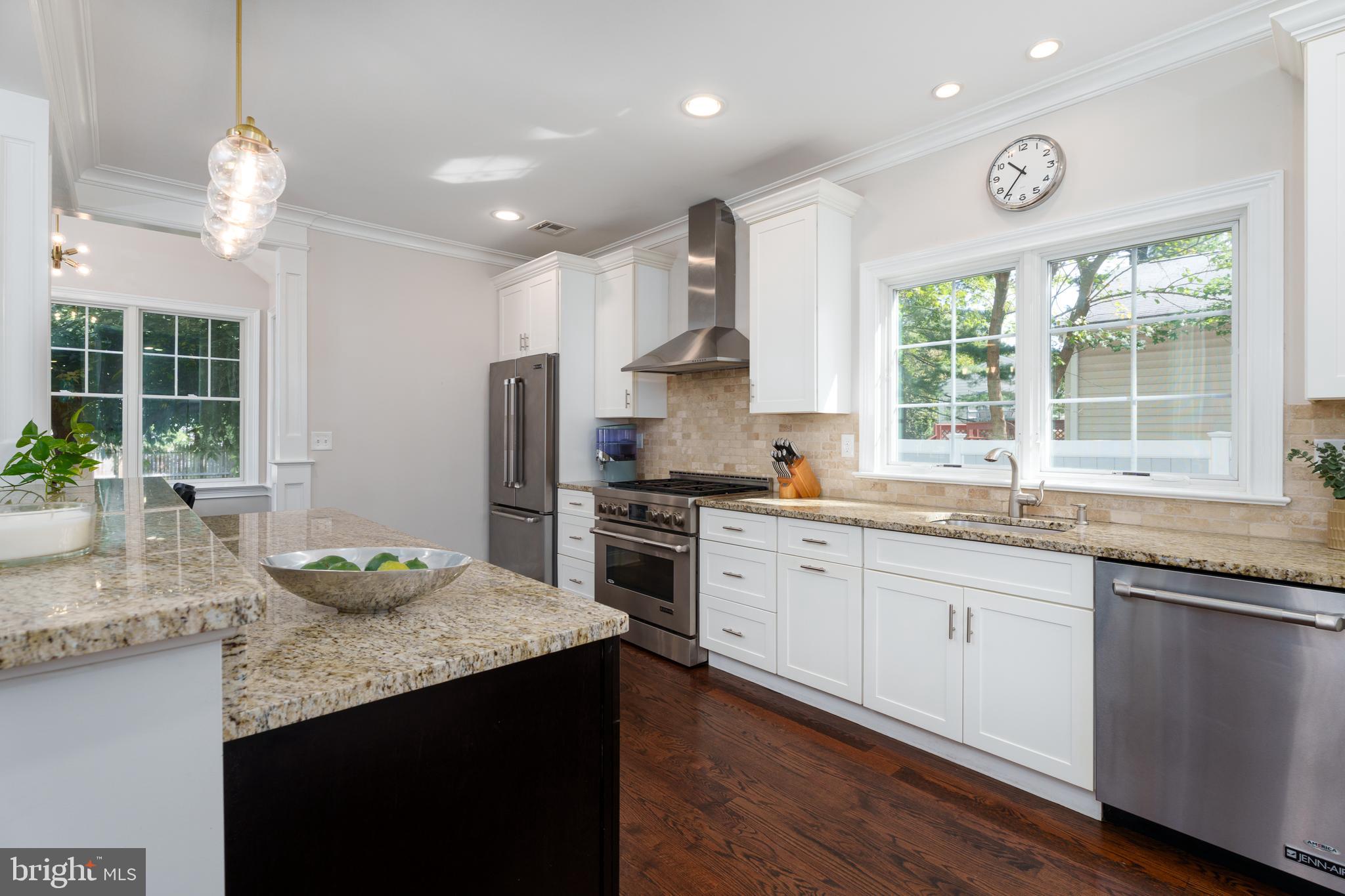 28 Hillside Road Princeton, NJ 08540 - Photo 14 of 31 a kitchen with granite countertop stainless steel appliances stove a sink and a large window