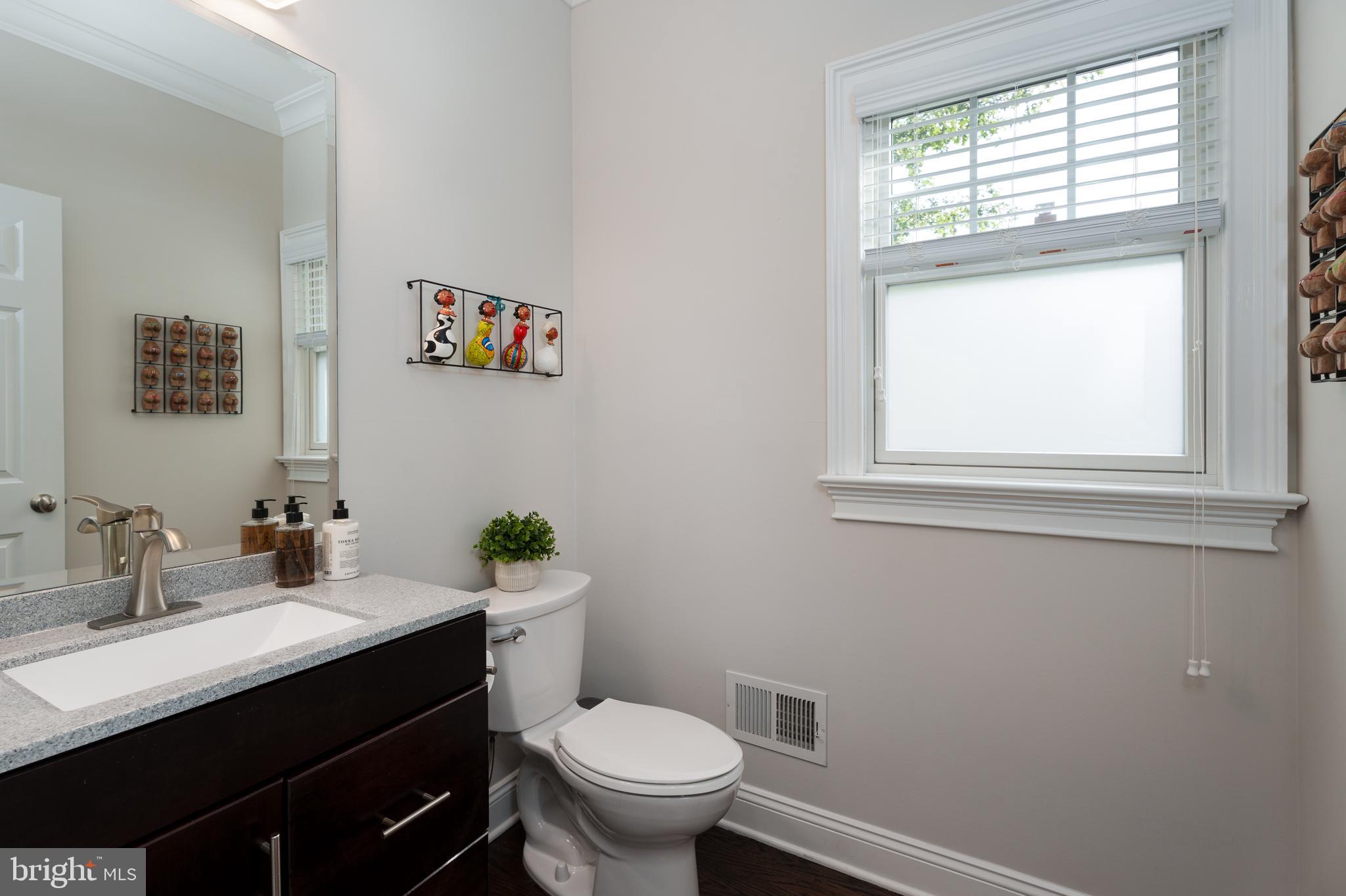 28 Hillside Road Princeton, NJ 08540 - Photo 16 of 31 a bathroom with a sink a toilet and a window