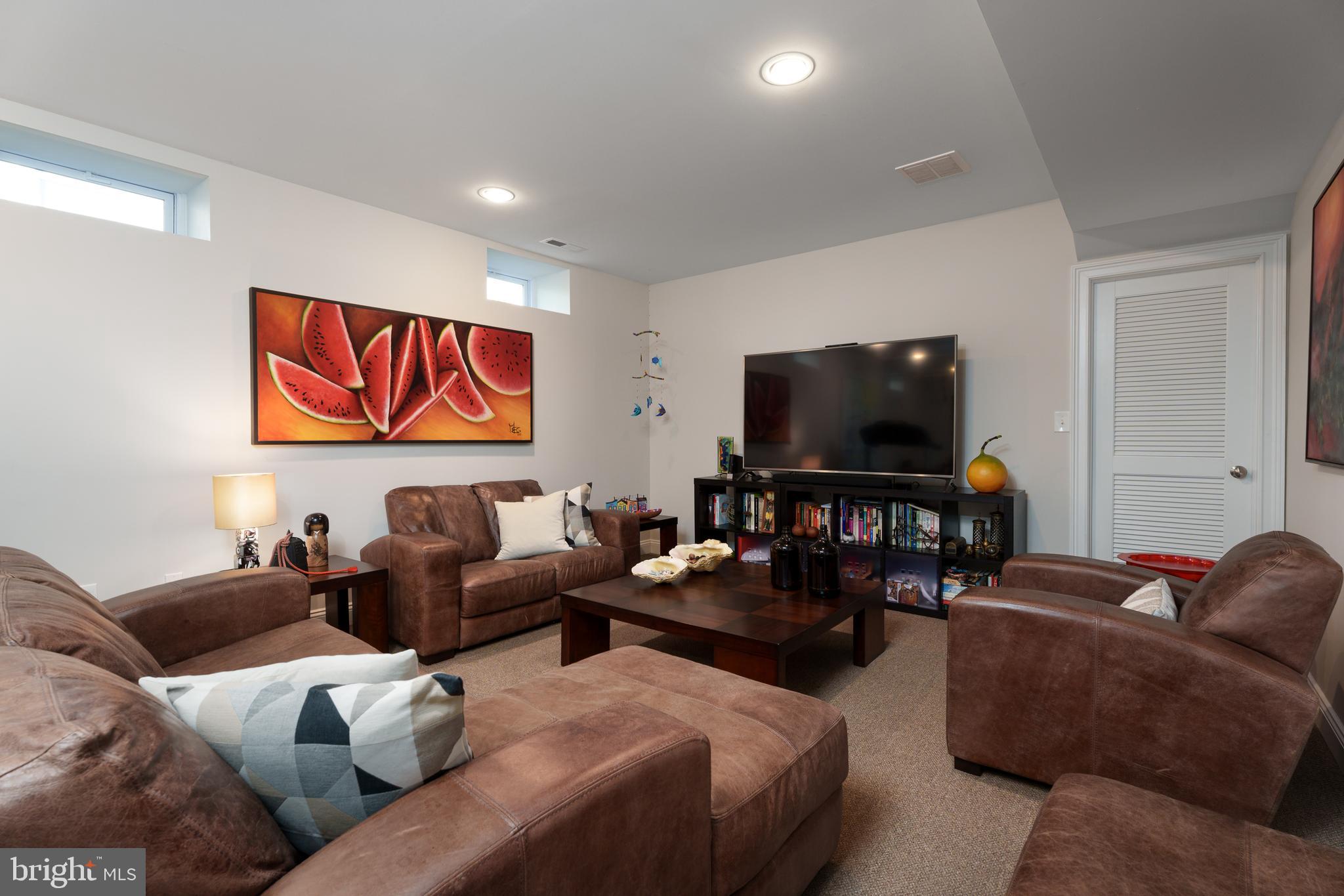 28 Hillside Road Princeton, NJ 08540 - Photo 25 of 31 a living room with furniture and a flat screen tv