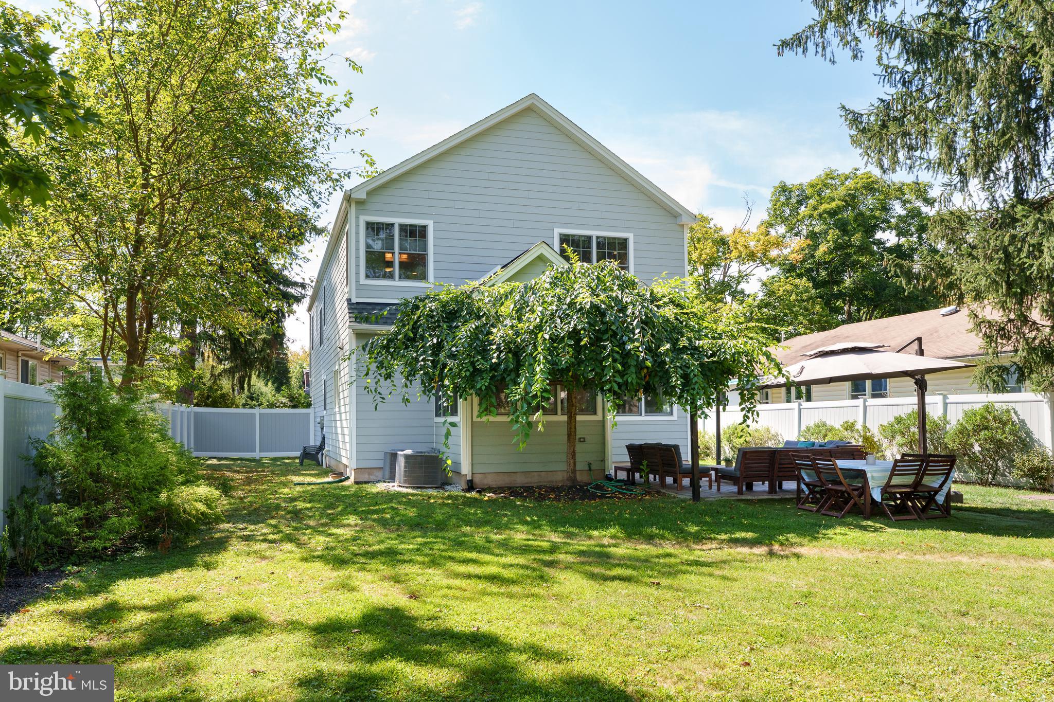 28 Hillside Road Princeton, NJ 08540 - Photo 28 of 31 a front view of a house with a garden and trees