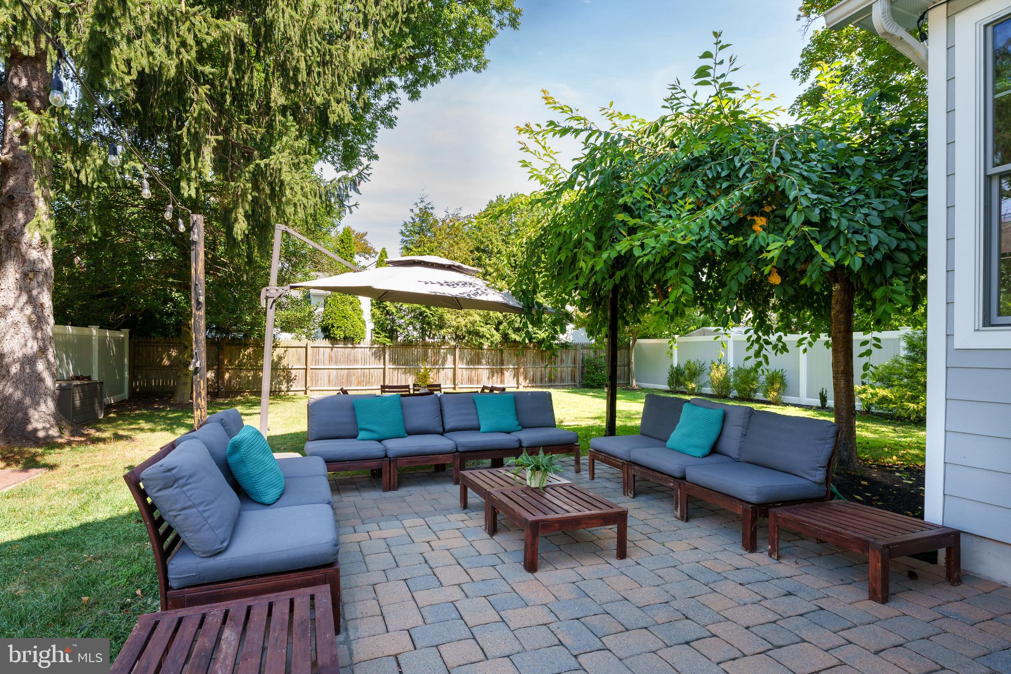 28 Hillside Road Princeton, NJ 08540 - Photo 31 of 31 a backyard of a house with barbeque oven table and chairs
