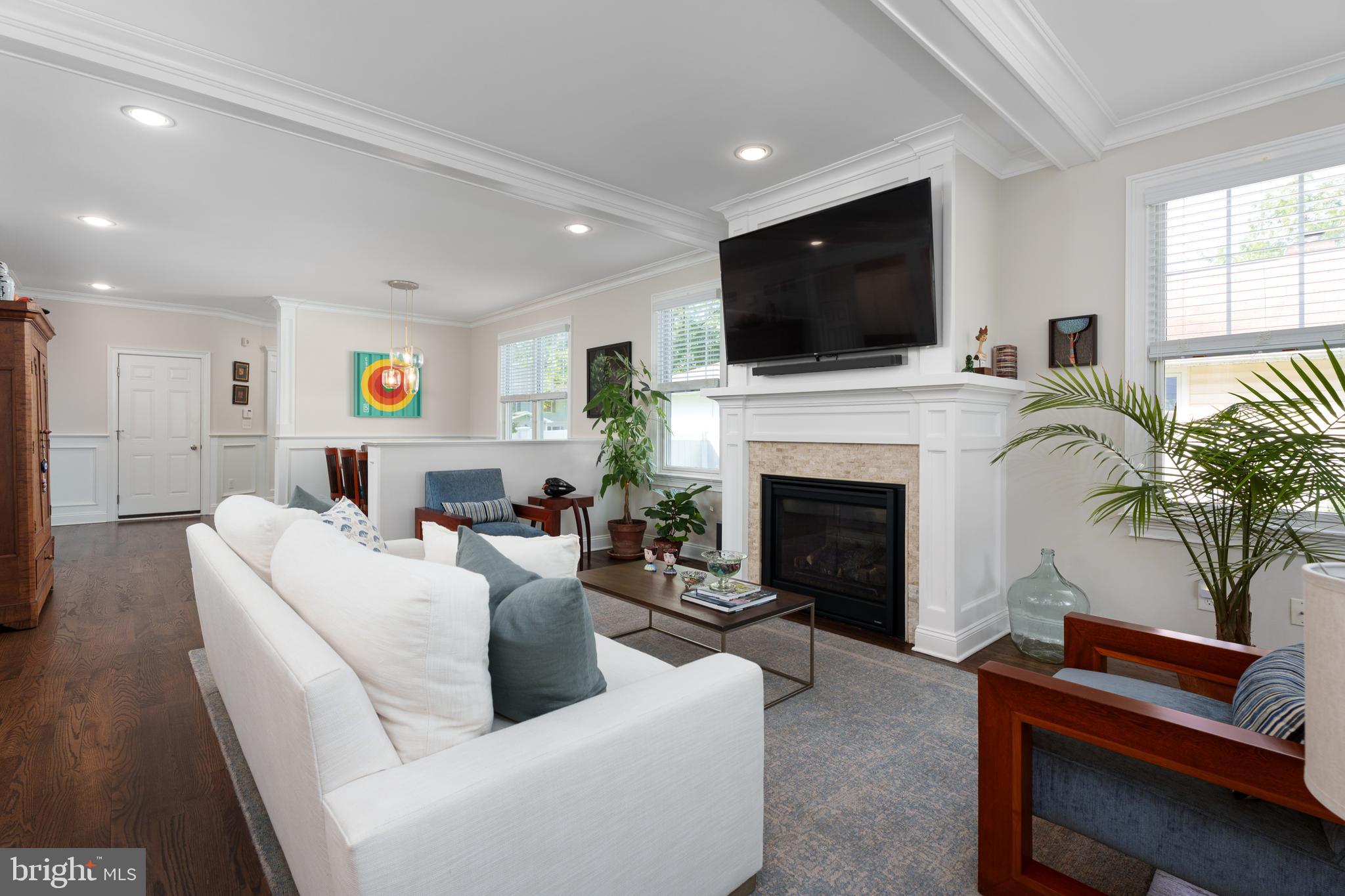28 Hillside Road Princeton, NJ 08540 - Photo 7 of 31 a living room with furniture a flat screen tv and a fireplace