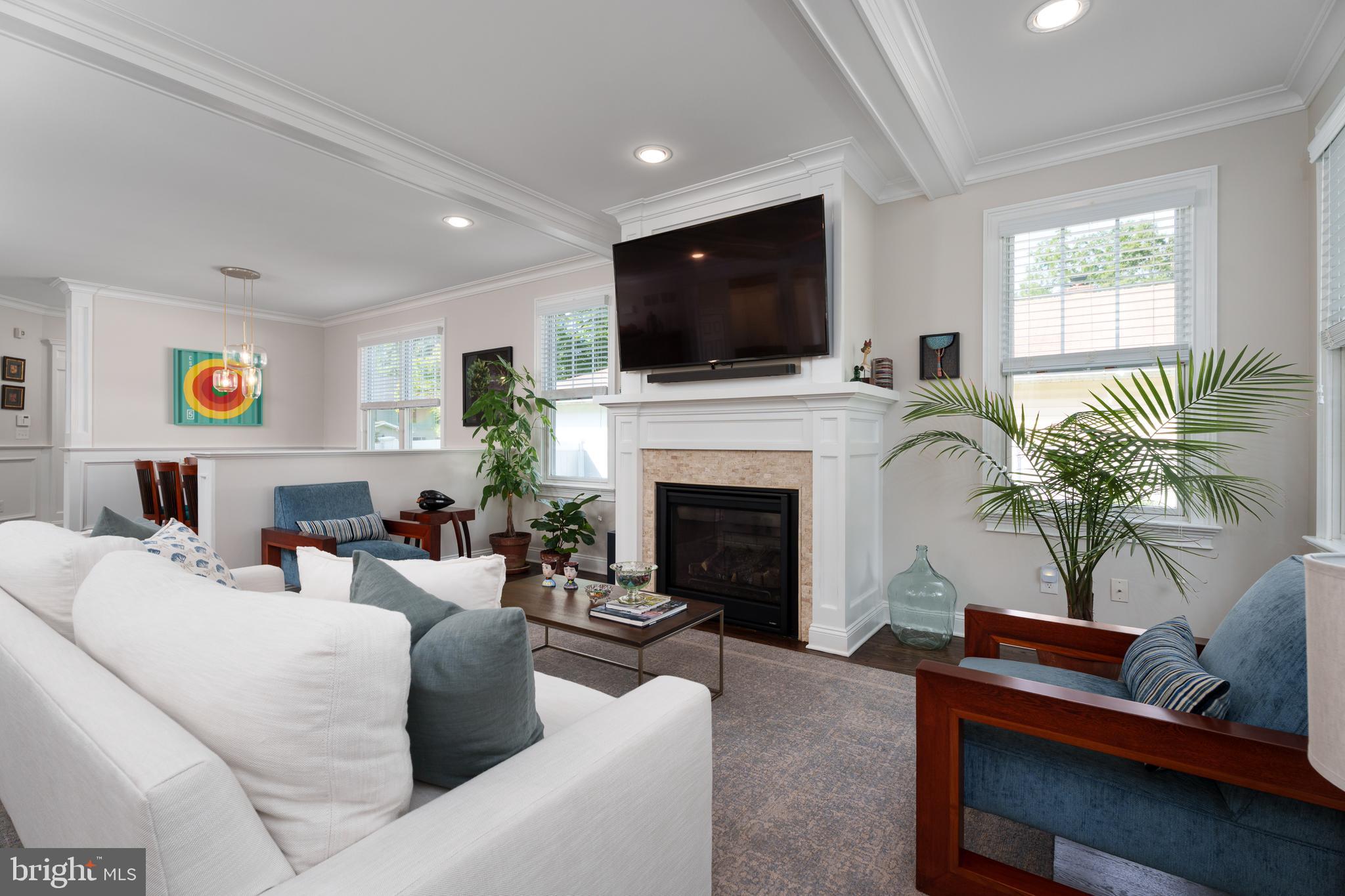 28 Hillside Road Princeton, NJ 08540 - Photo 8 of 31 a living room with furniture fireplace and a flat screen tv