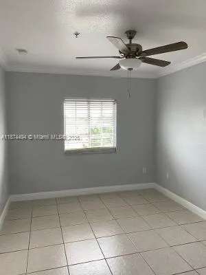 a front view of building with cars parked