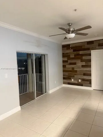 a view of room with a ceiling fan