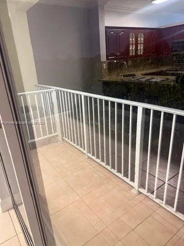 a view of balcony with wooden floor