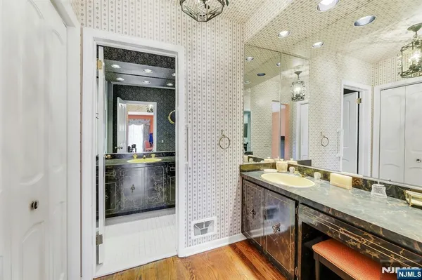 a bathroom with a sink and a mirror