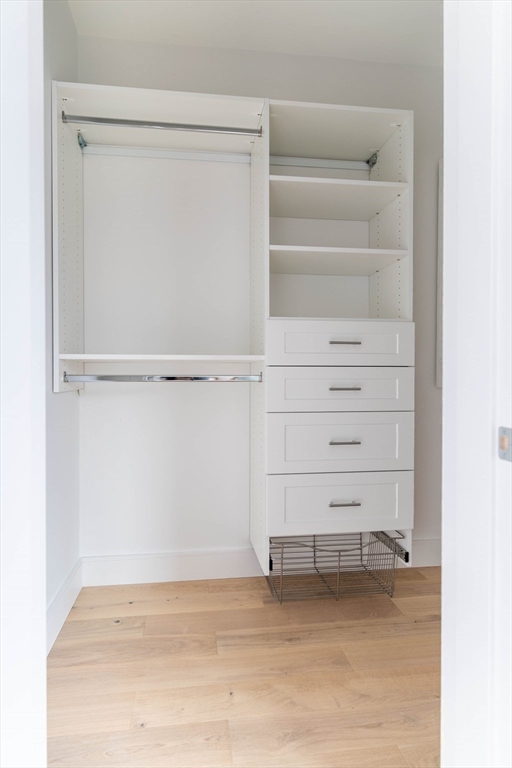 106 Webster Street, Unit 201 Boston, MA 02128 - Photo 22 of 33 a view of walk in closet with empty racks