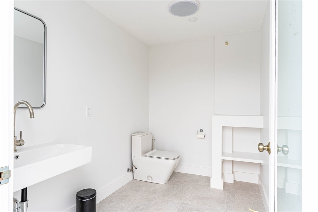 106 Webster Street, Unit 201 Boston, MA 02128 - Photo 28 of 33 a bathroom with a sink a toilet and shower
