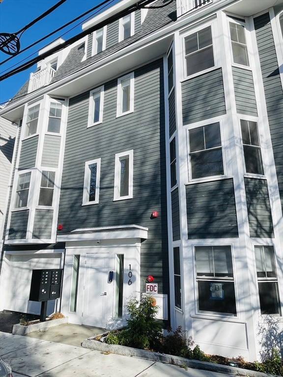 106 Webster Street, Unit 201 Boston, MA 02128 - Photo 32 of 33 a front view of a building with a street
