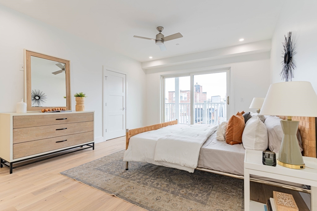 106 Webster Street, Unit 201 Boston, MA 02128 - Photo 9 of 33 a bedroom with a bed and window